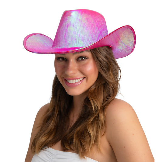 Pink iridescent cowboy hat with wide brim, worn by a model with long wavy light brown hair and a white off-shoulder top.