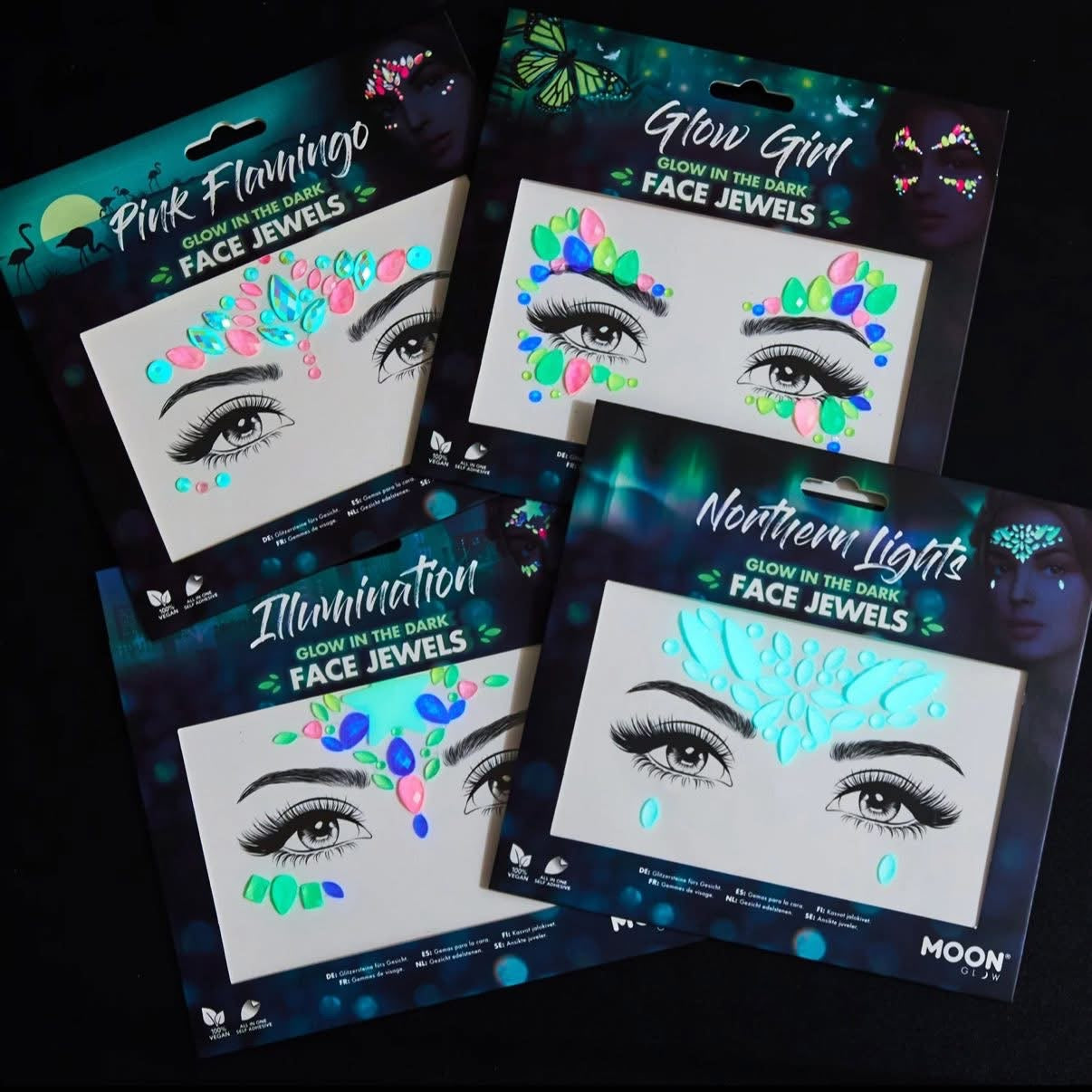 A collection and choice of glow-in-the-dark face jewels from toast and tonic with colourful designs on a black background.