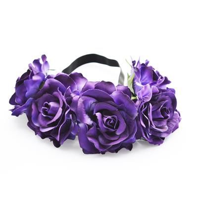 A headband adorned with artificial purple flowers make a good flower crown