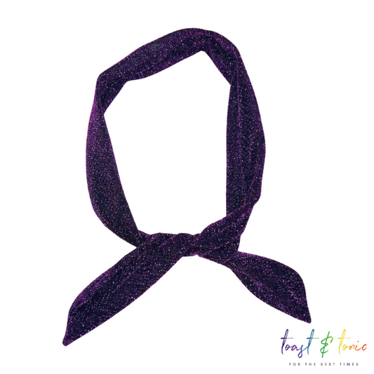 glittery wired headband in purple on a white background