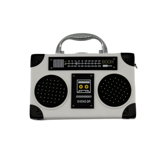 A white clutch bag designed to resemble a vintage radio with black details and a silver handle.