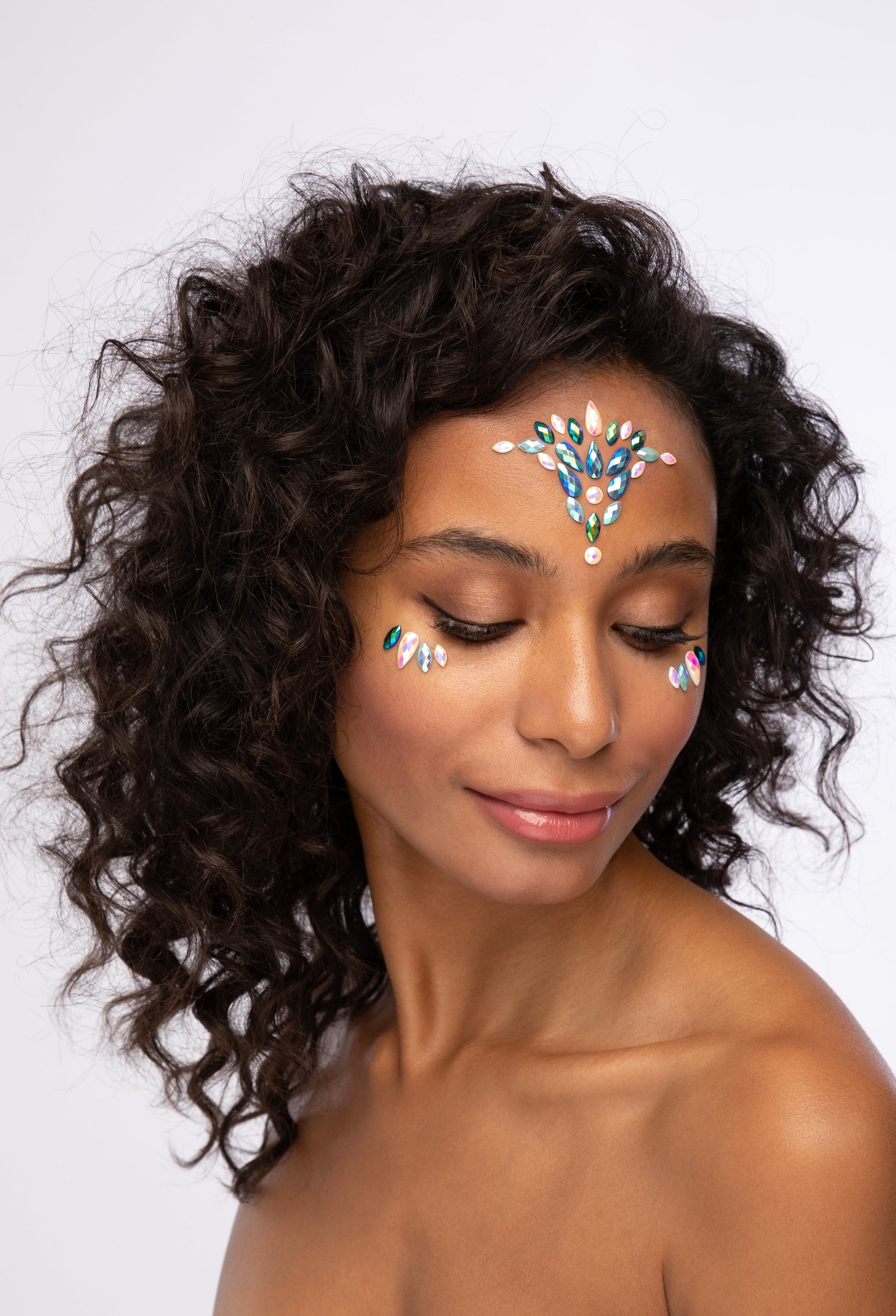 Face jewels and face gems on face, mystic mermaid