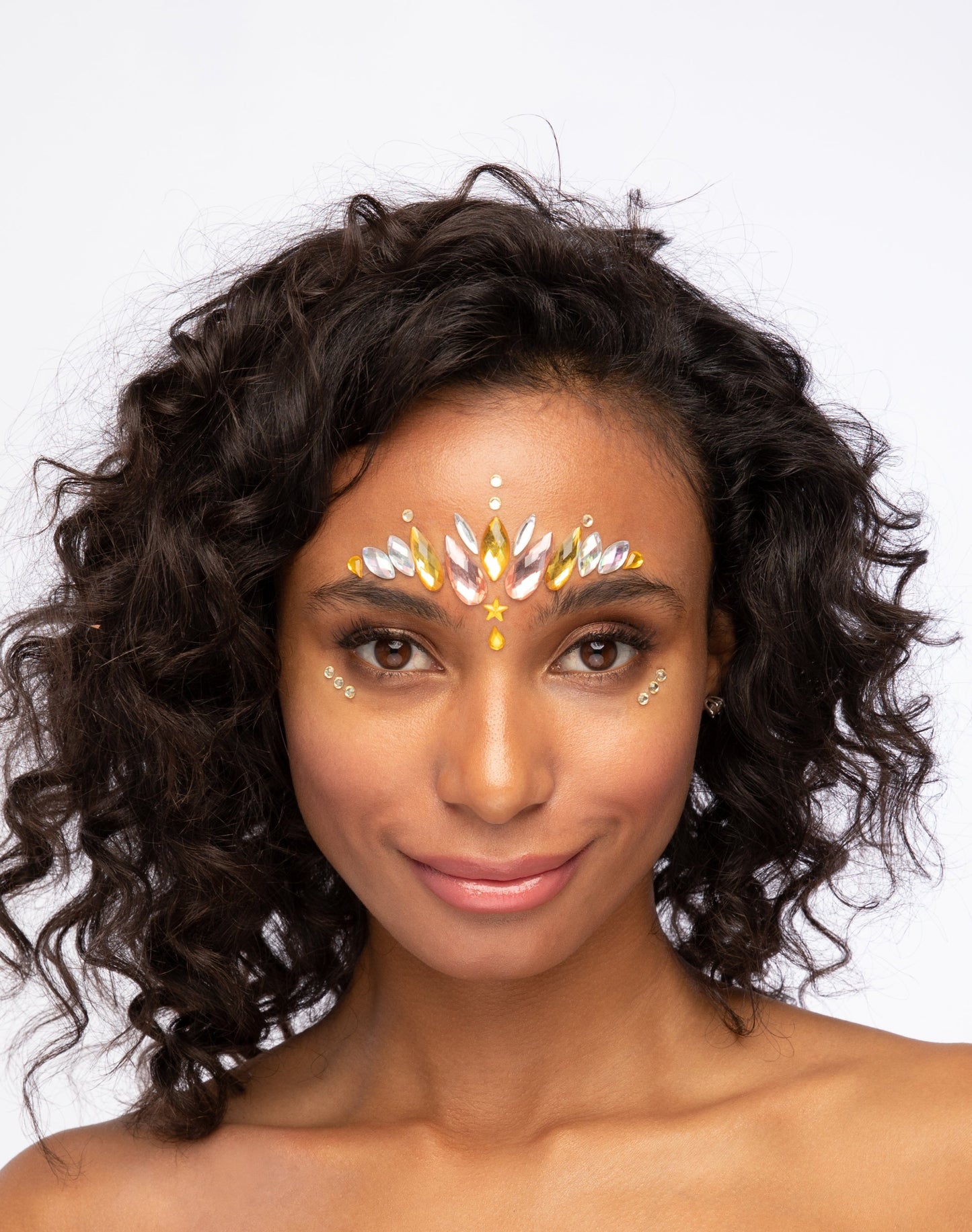 Face jewels and face gems on face, sunset goddess