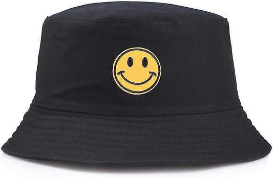 Black bucket hat with a yellow smiley face emblem on a white background