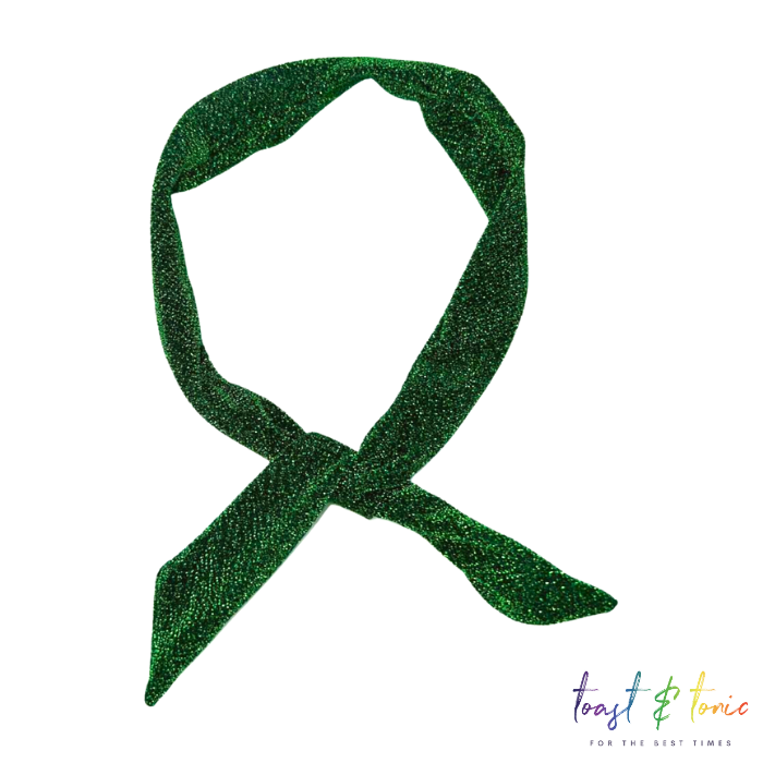 glittery wired headband in green on a white background